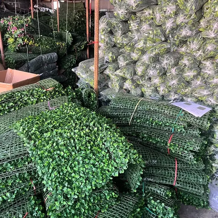 Eco-friendly artificial green wall panel with dense boxwood leaves