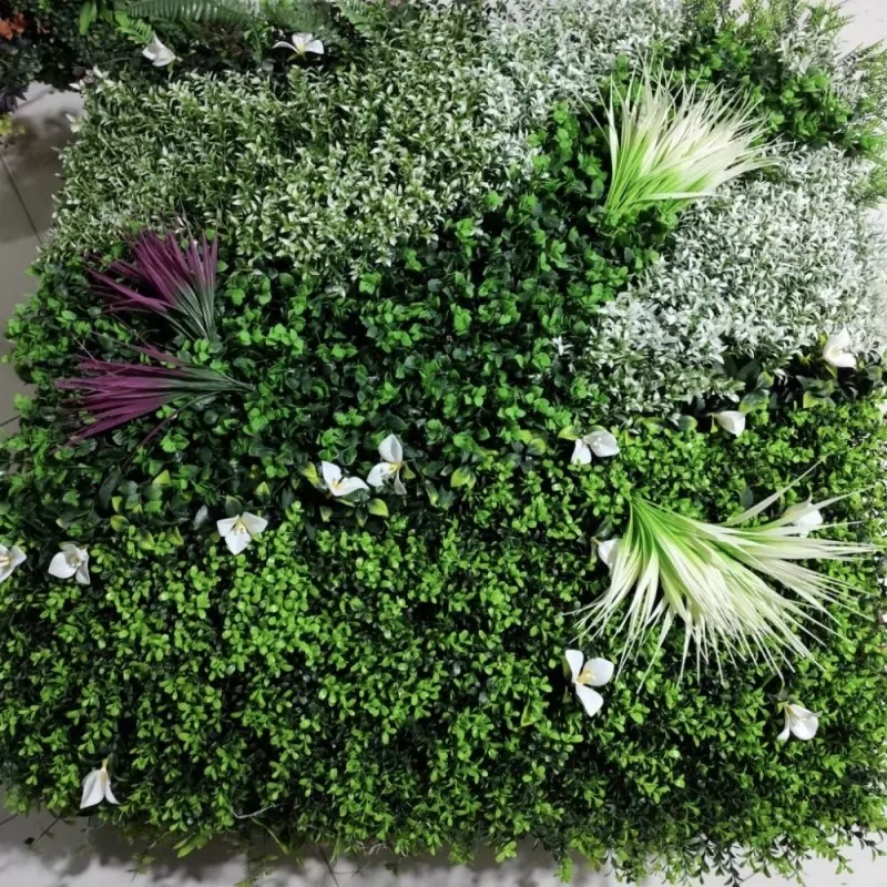 OULI synthetic grass wall with spider plants and dracaena