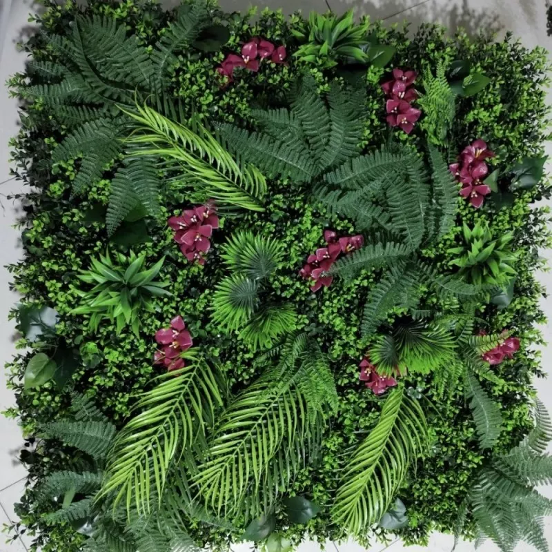 Faux plant wall with floral accents and minimalistic style